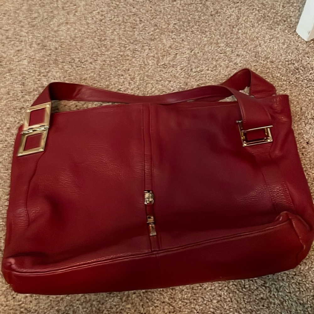 Red bucket bag. Measures 13h” by 17” 10” handle drop.